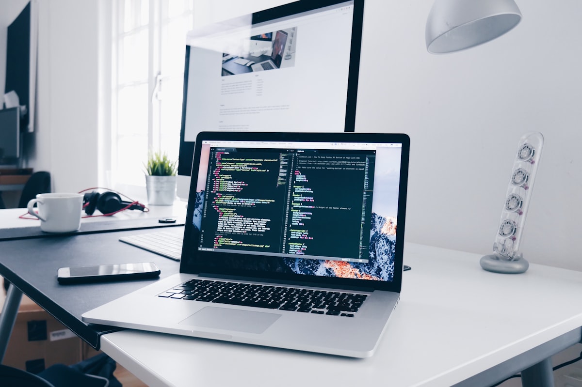 Laptop with code editor for corporate website development